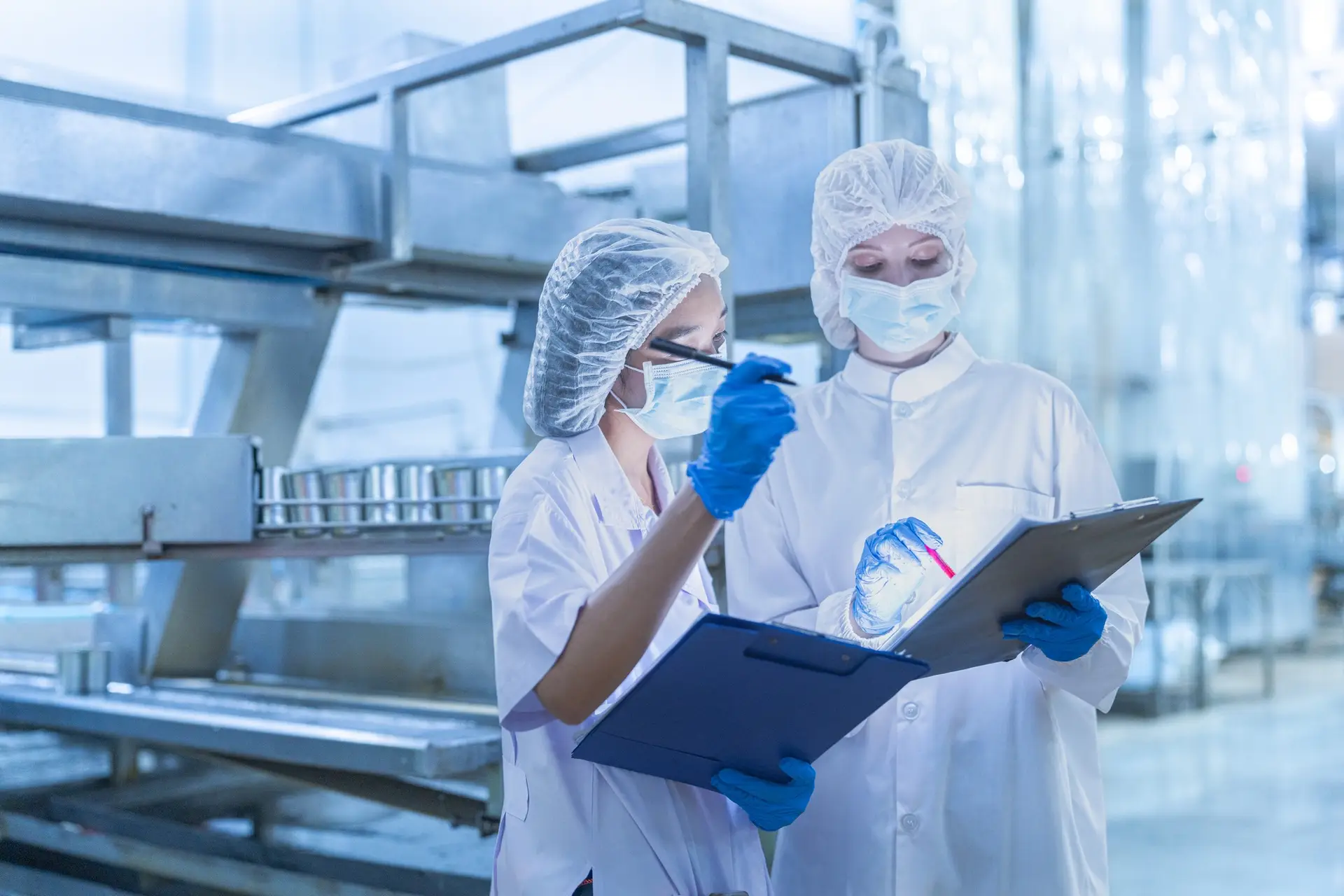 The research team inspected the seafood production line and machinery.